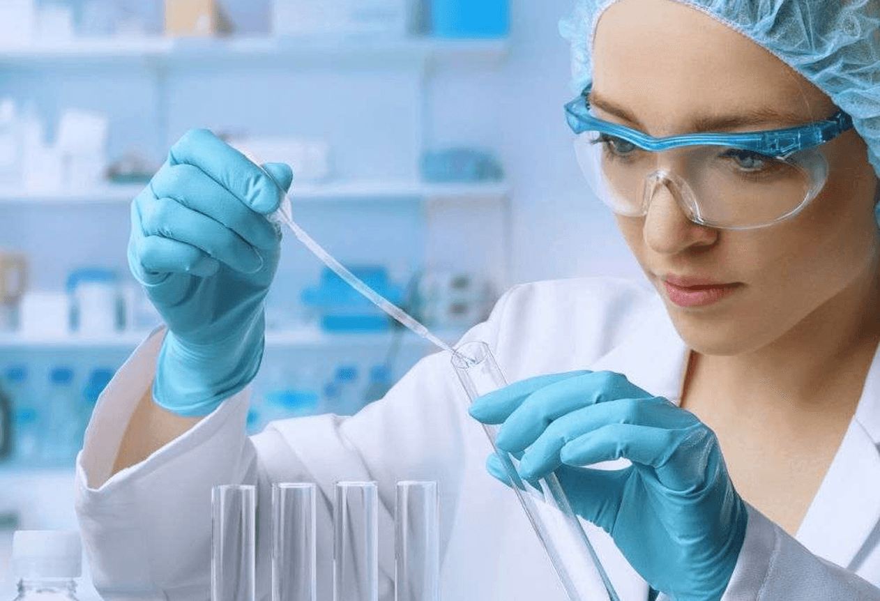 A woman inspecting a testube